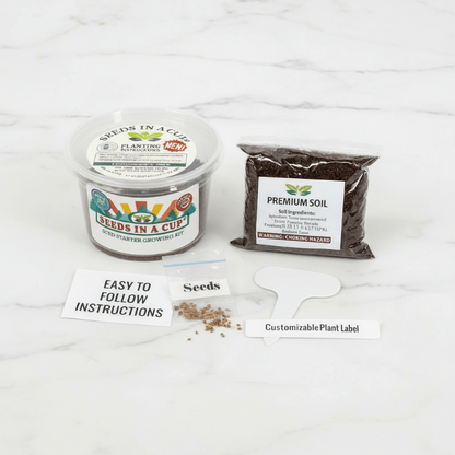 Seeds In A Cup Apple Tree grow kit with all included contents: non-GMO seeds, real loose potting soil, recyclable planter, and step-by-step growing instructions. Made in Cleveland, Ohio.